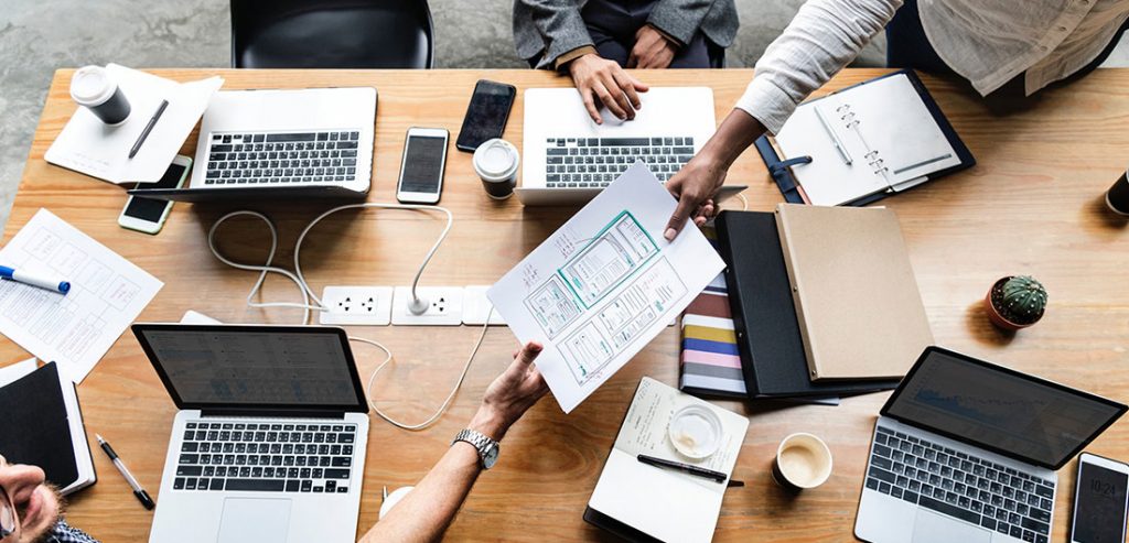 5 Mistakes Your Internal Marketing Team Are Making Image computers on desk