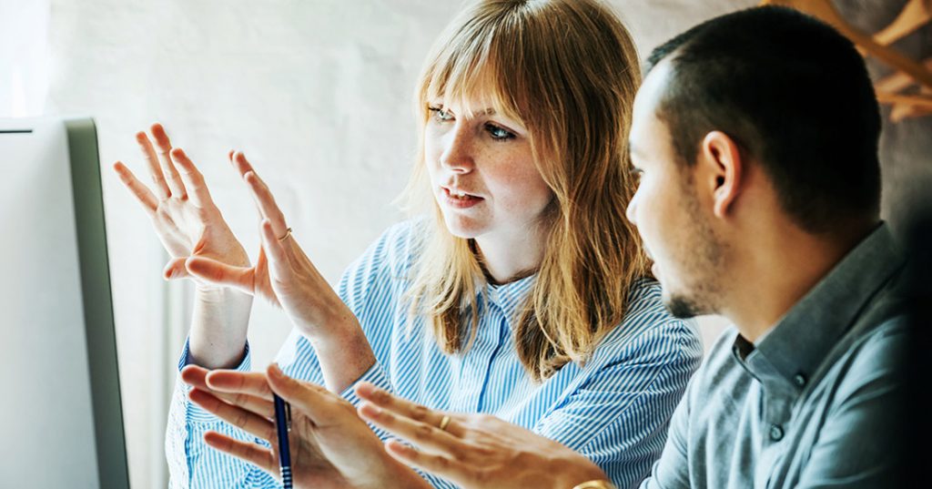 5 Mistakes Your Internal Marketing Team Are Making Image woman and man working